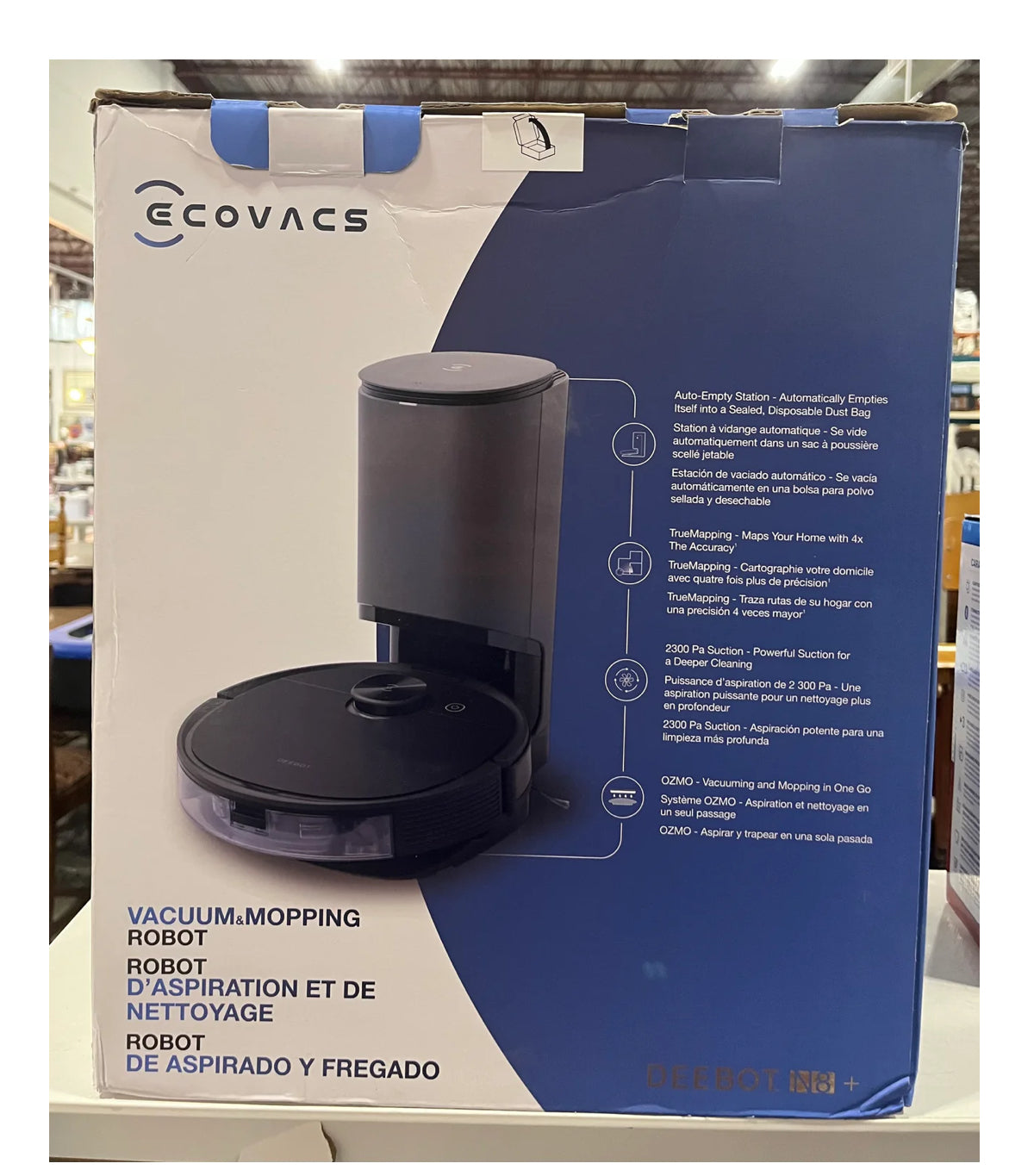 This box contains the ECOVACS DEEBOT 10+, an all-in-one robot vacuum and mop designed for automated home cleaning.